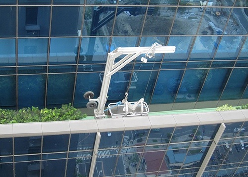 Davit hidden behind parapet