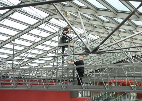Traversing gantry with a foldable tower